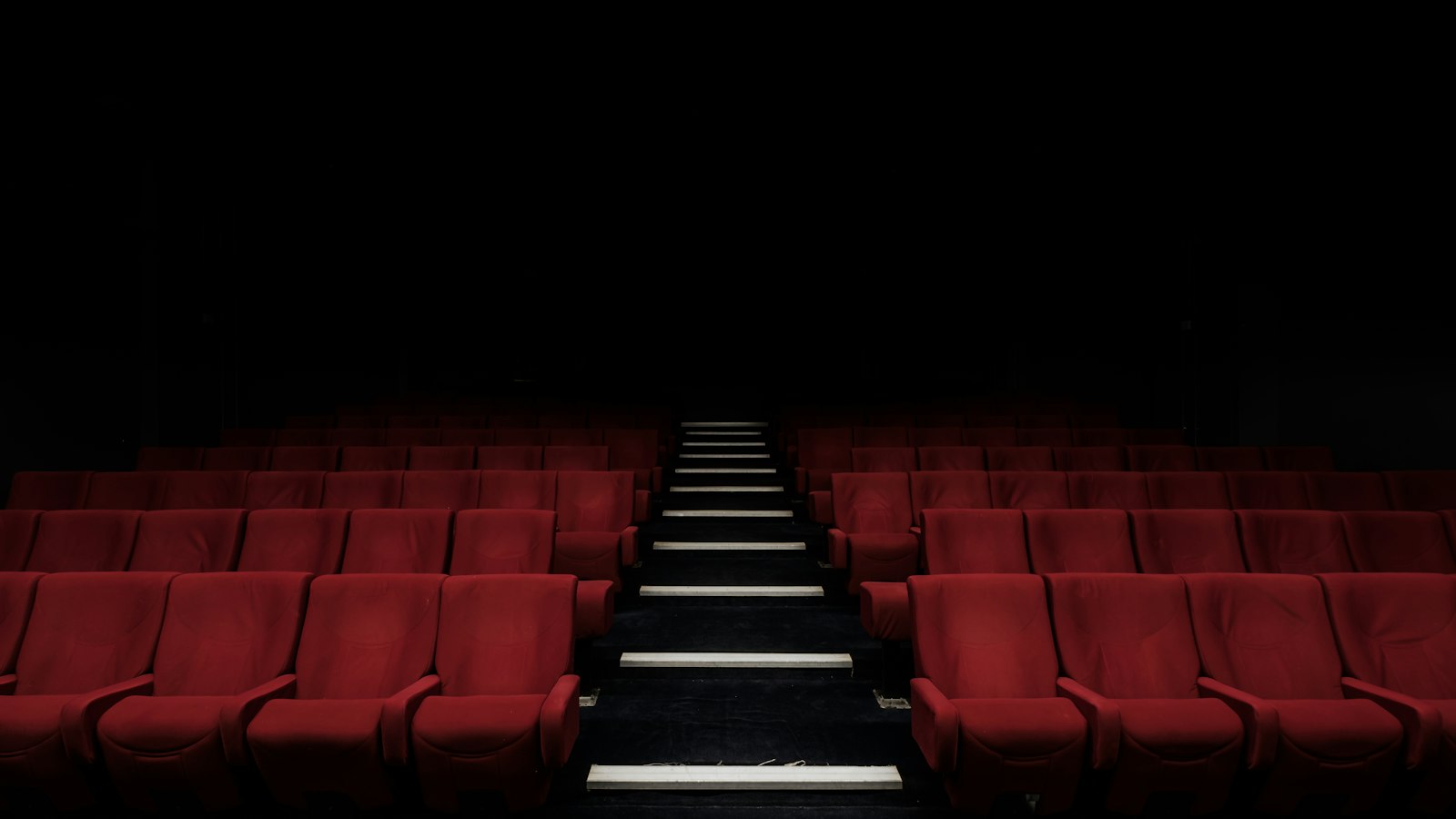 Rows of red cinema seats