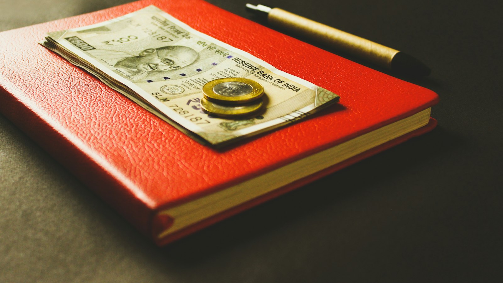 Coins resting on banknotes