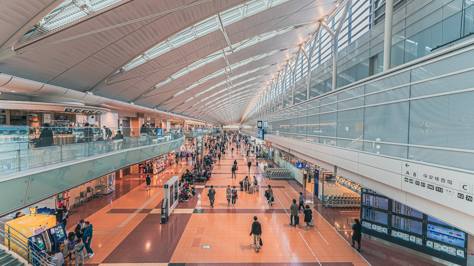 Travellers walking through an airport terminal