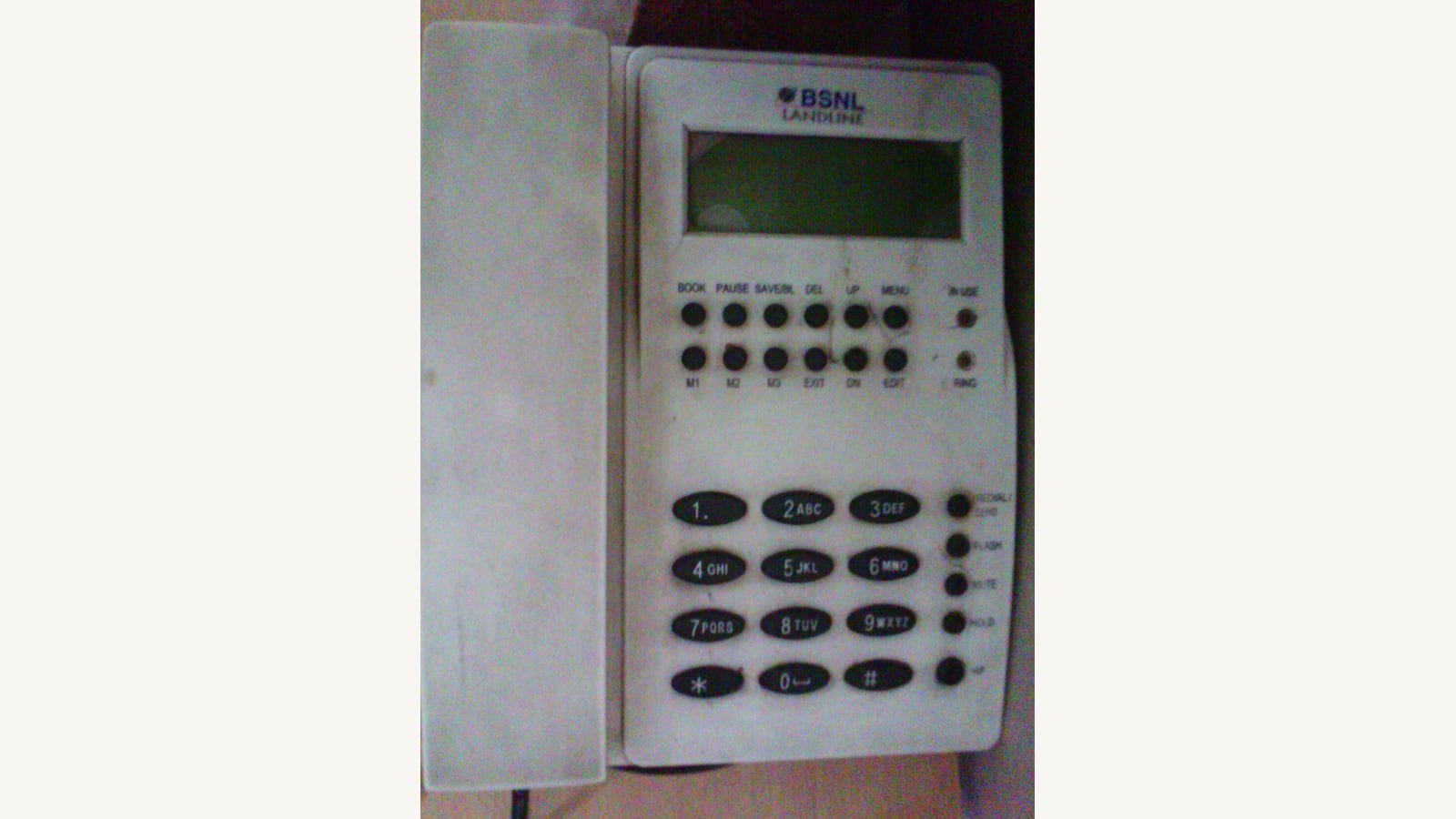 A landline telephone with handset and keypad. Illustrative photograph, not a TIS National telephone.