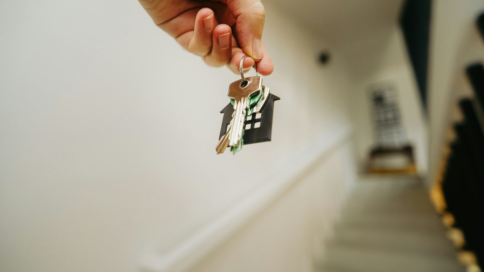 A person holding a house key