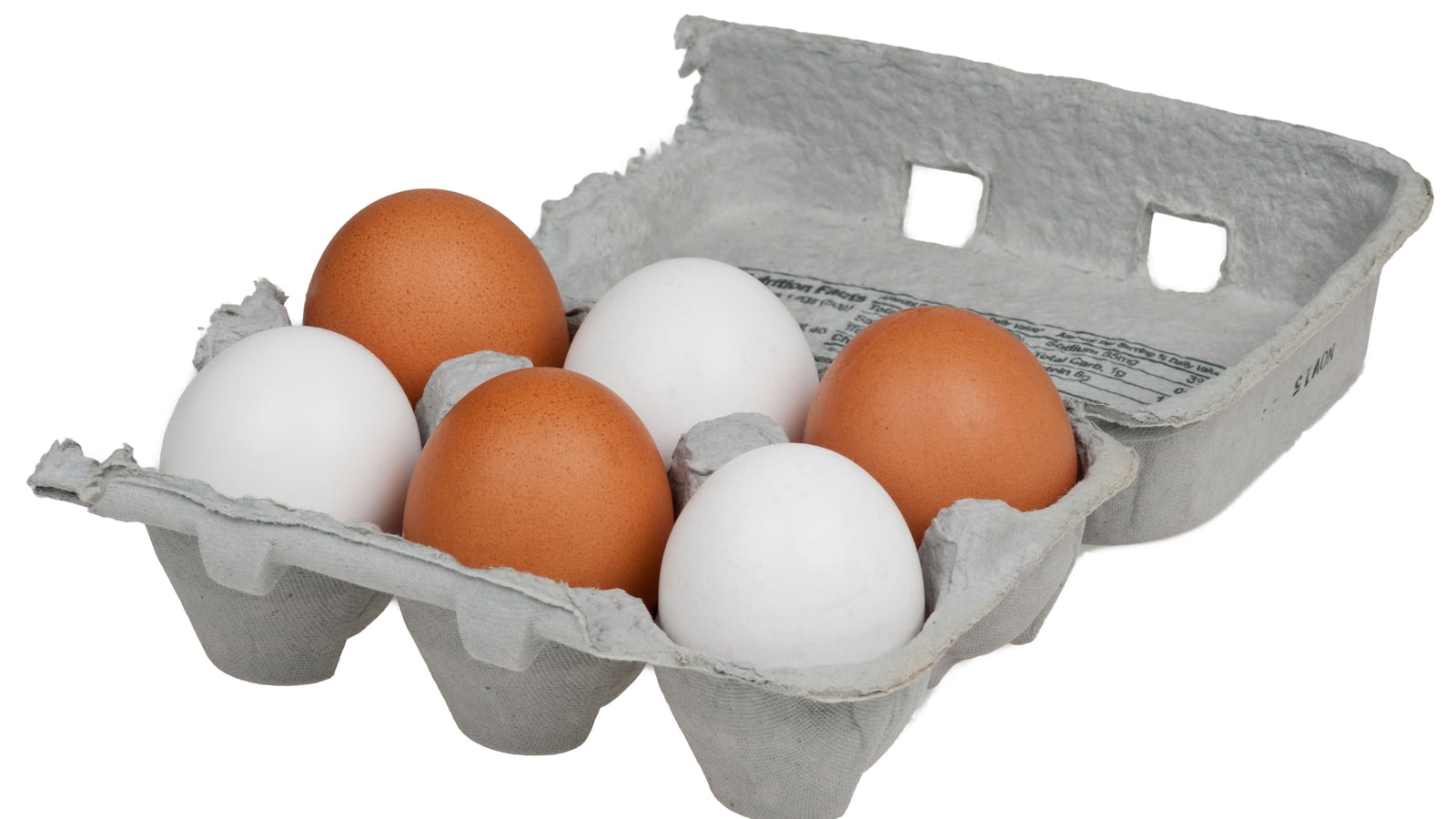 A carton of six white and brown chicken eggs