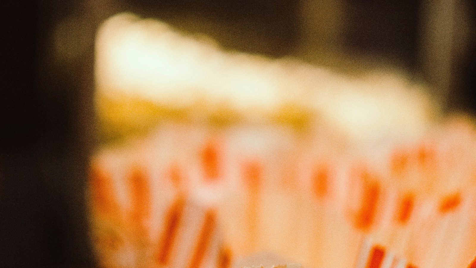 Popcorn in striped paper bags in a cinema